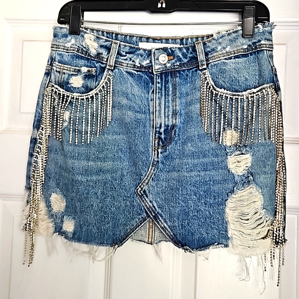Upcycled distressed denim skirt with rhinestone fringe